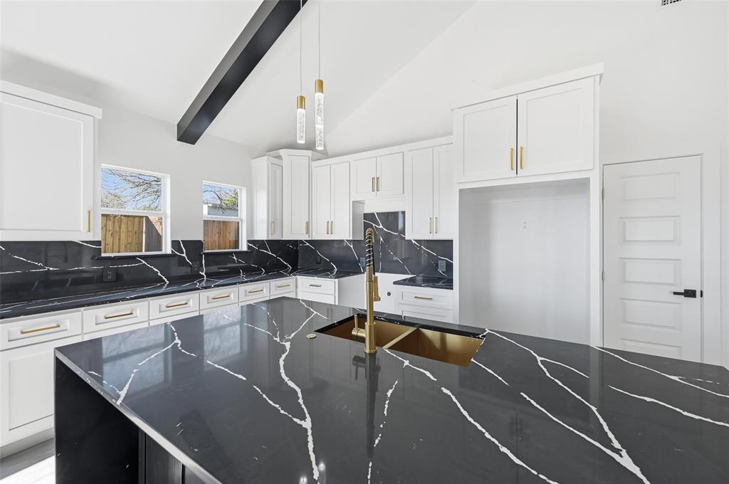 2618 Gooch Street Dallas, TX 75241 - Photo 9 of 28 a kitchen with stainless steel appliances granite countertop a sink a stove and white cabinets