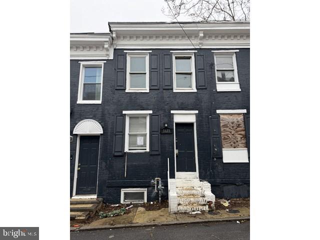 1611 Lemmon Street Baltimore, MD 21223 - Photo 1 of 20 a view of a brick house with large windows
