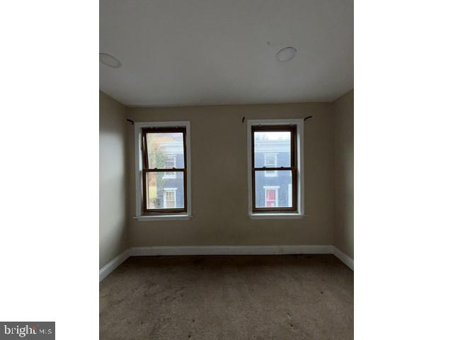 1611 Lemmon Street Baltimore, MD 21223 - Photo 11 of 20 a view of an empty room with windows
