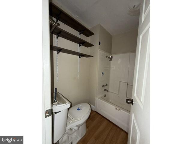 1611 Lemmon Street Baltimore, MD 21223 - Photo 15 of 20 a bathroom with a granite countertop sink toilet and shower