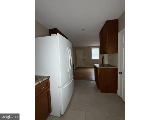 1611 Lemmon Street Baltimore, MD 21223 - Photo 8 of 20 a kitchen with a refrigerator and a stove