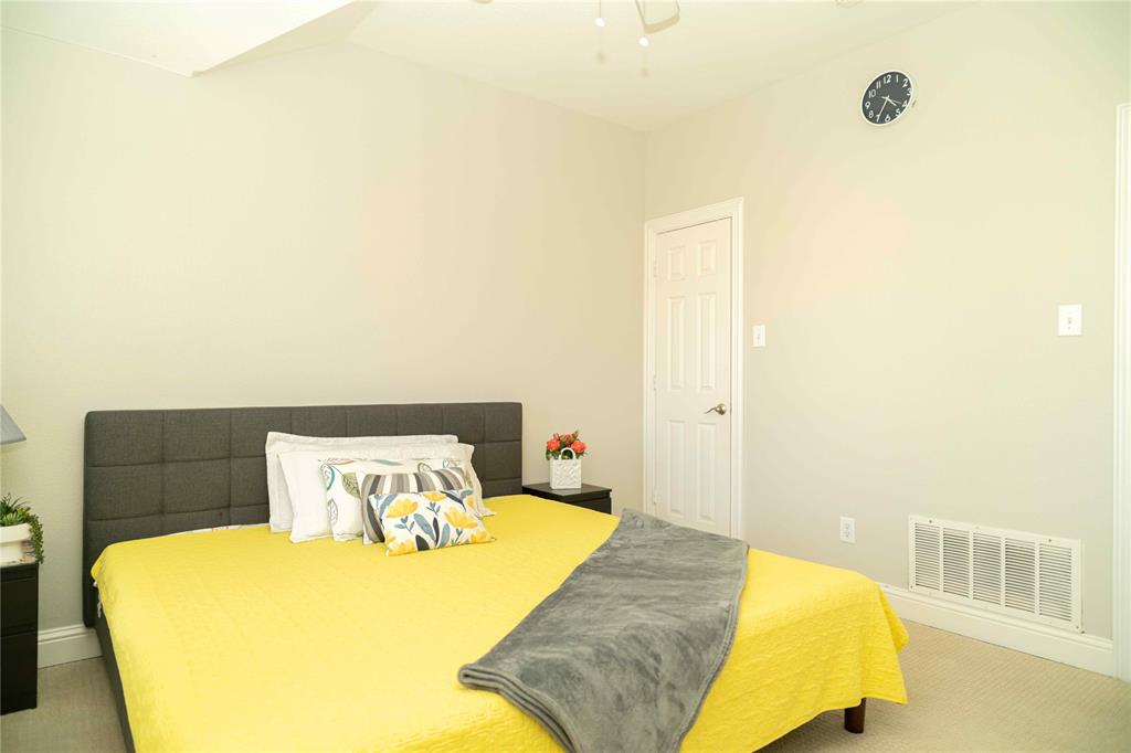 6851 Verde Irving, TX 75039 - Photo 29 of 40 a bedroom with a bed and wooden floor