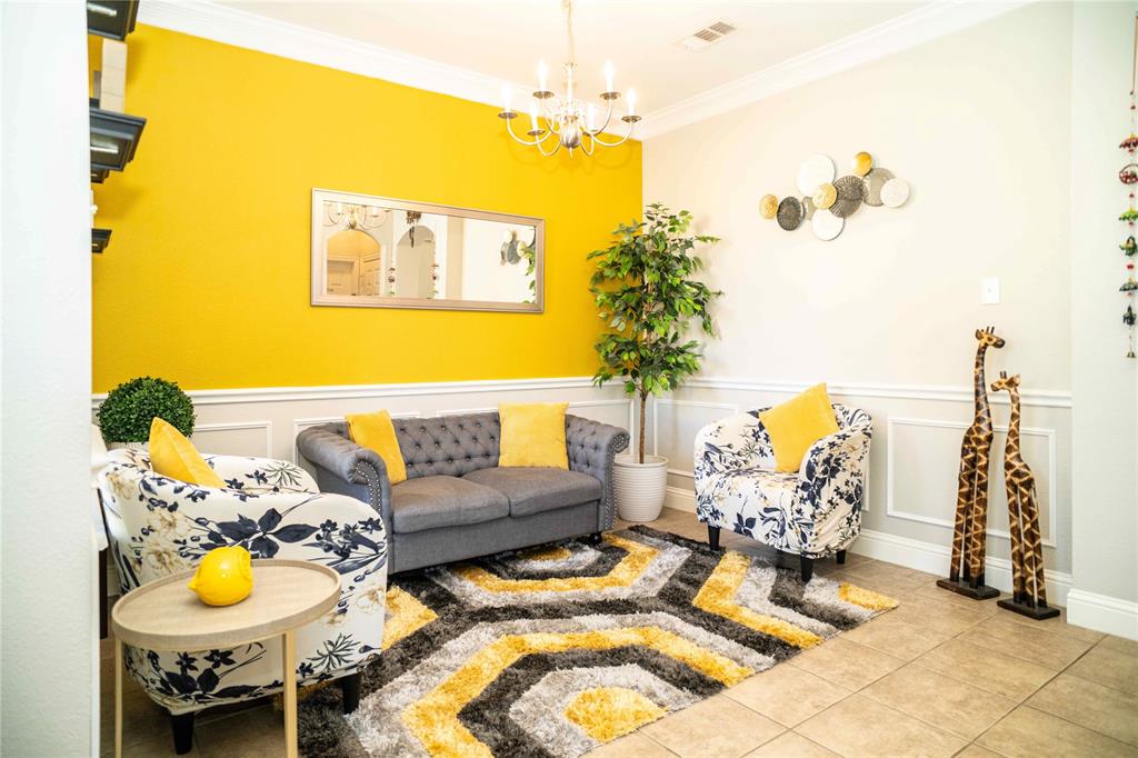 6851 Verde Irving, TX 75039 - Photo 6 of 40 a living room with furniture and a chandelier