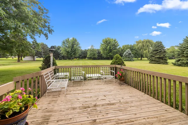 a view of a balcony with wooden floor