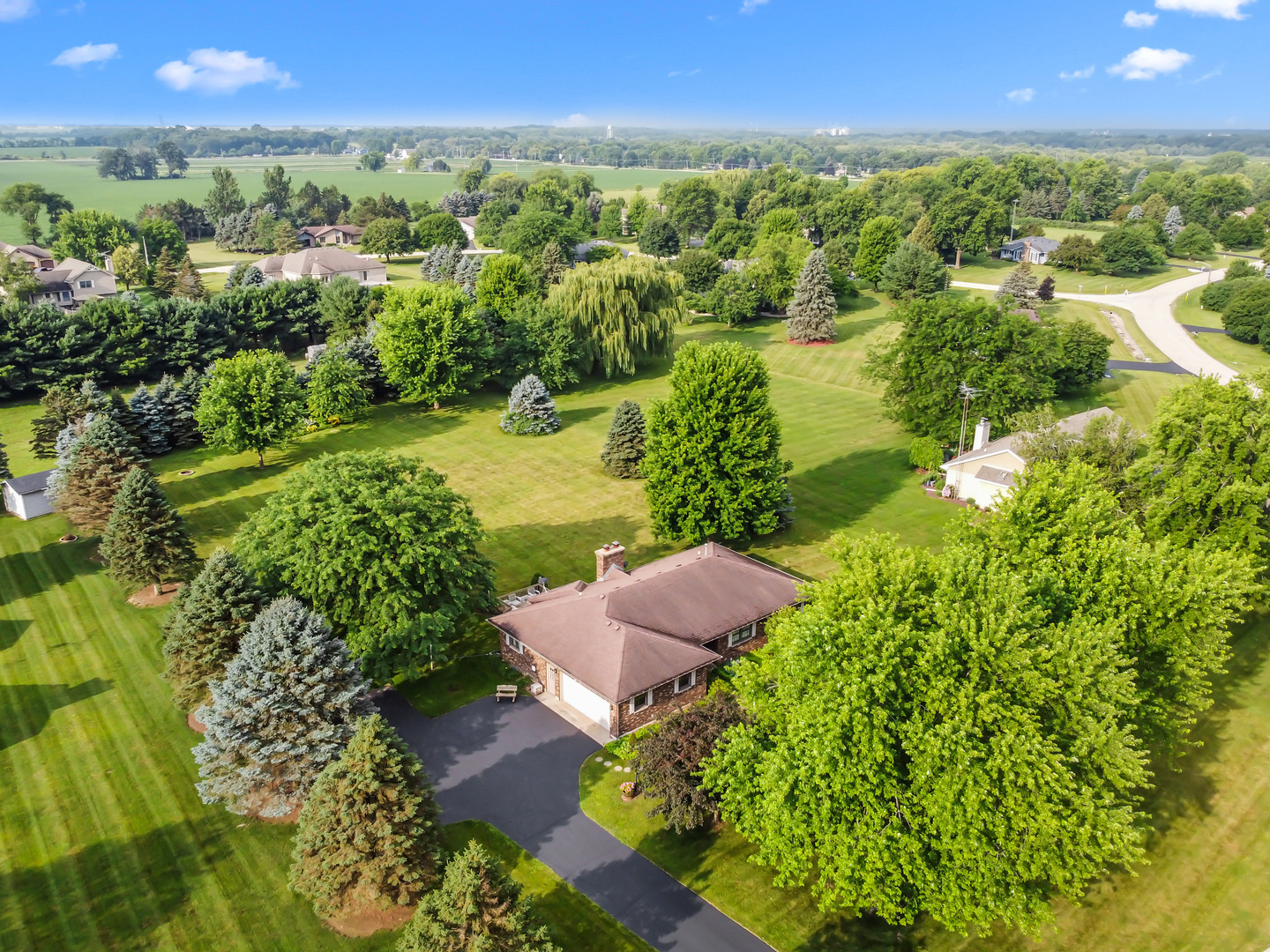 23201 Norma Lane Harvard, IL 60033 - Photo 21 of 24 an aerial view of residential houses with outdoor space and trees