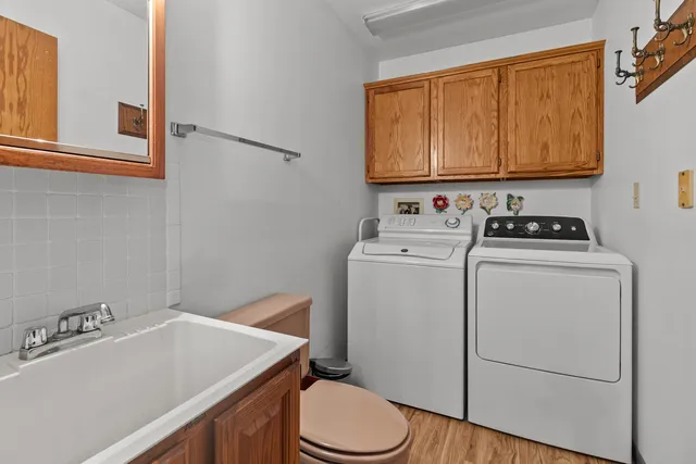 a bathroom with a sink a toilet and a tub