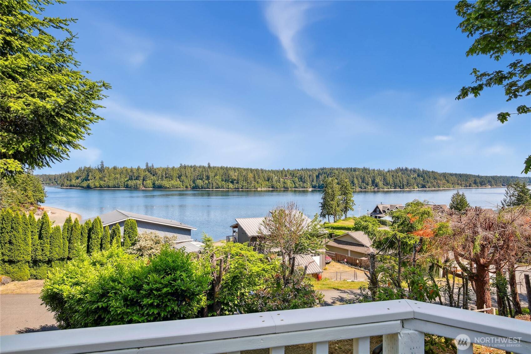 70 East Rustle Way Grapeview, WA 98546 - Photo 1 of 1 a view of a lake from a balcony