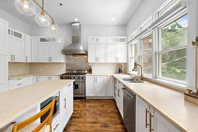 a kitchen with a sink stove and refrigerator