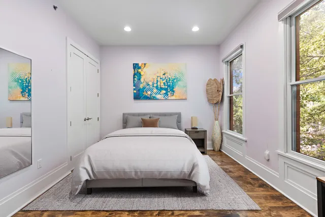 a bedroom with a bed and a couch