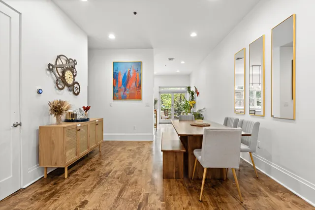 a dining room with furniture and window