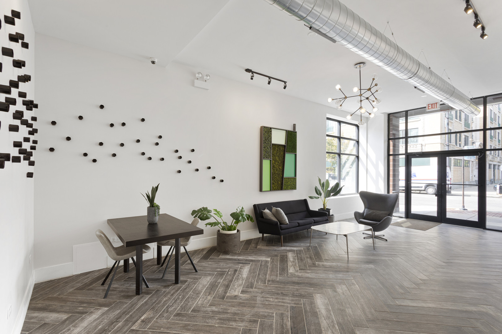 1531 West Howard Street, Unit 407 Chicago, IL 60626 - Photo 15 of 15 a living room with furniture and wooden floor