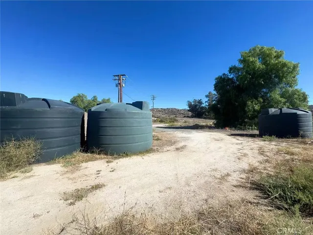 a view of wooden fence and trees