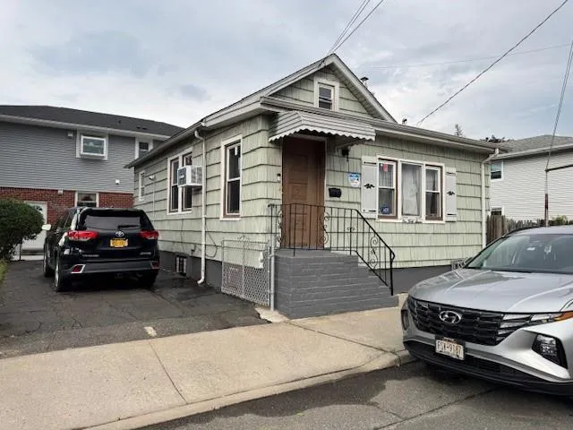 a car parked in front of a house