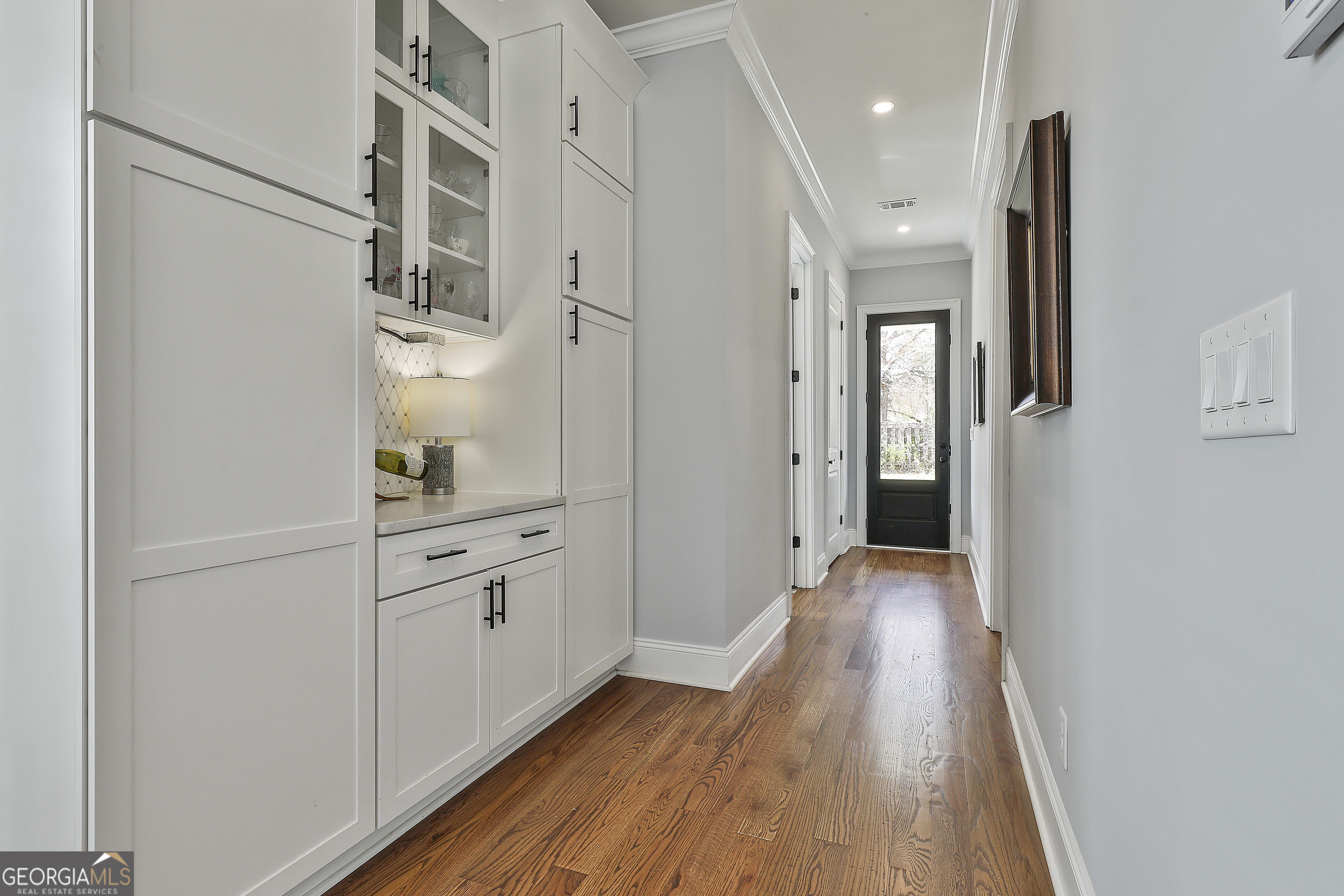 6 Casey Road Newnan, GA 30263 - Photo 22 of 46 a hallway with cabinets and wooden floor