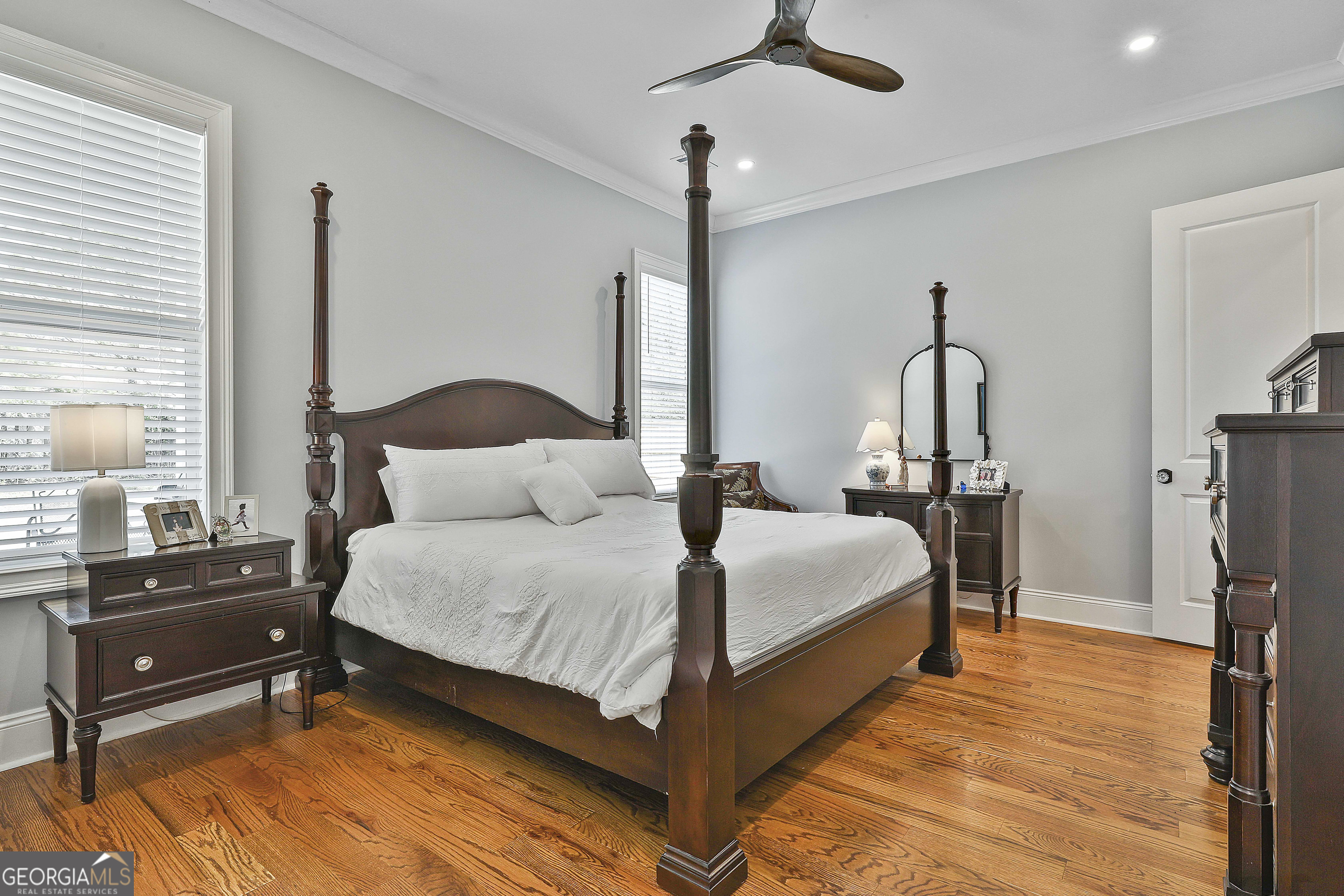 6 Casey Road Newnan, GA 30263 - Photo 24 of 46 a bedroom with a bed a flat screen tv and a large window