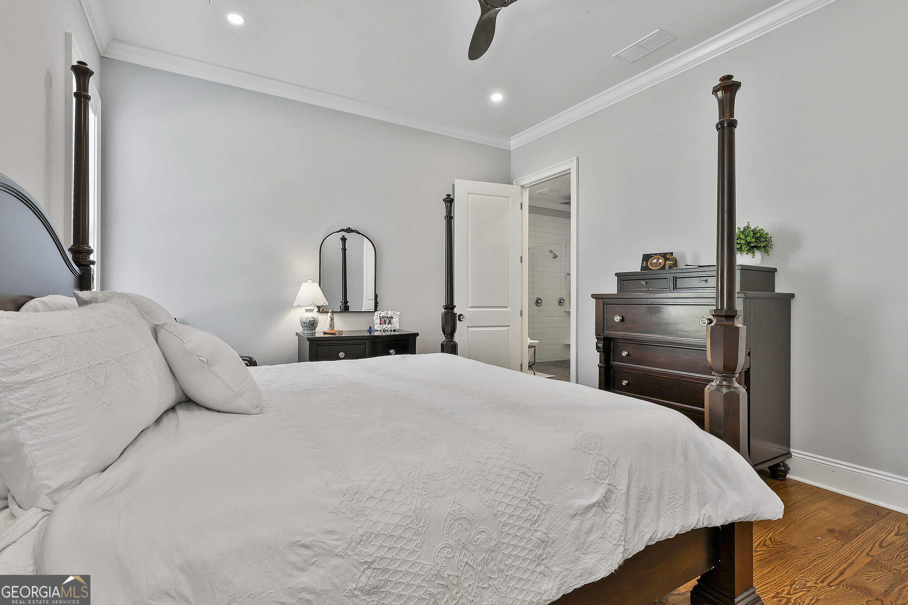 6 Casey Road Newnan, GA 30263 - Photo 25 of 46 a bedroom with a bed and dresser with mirror