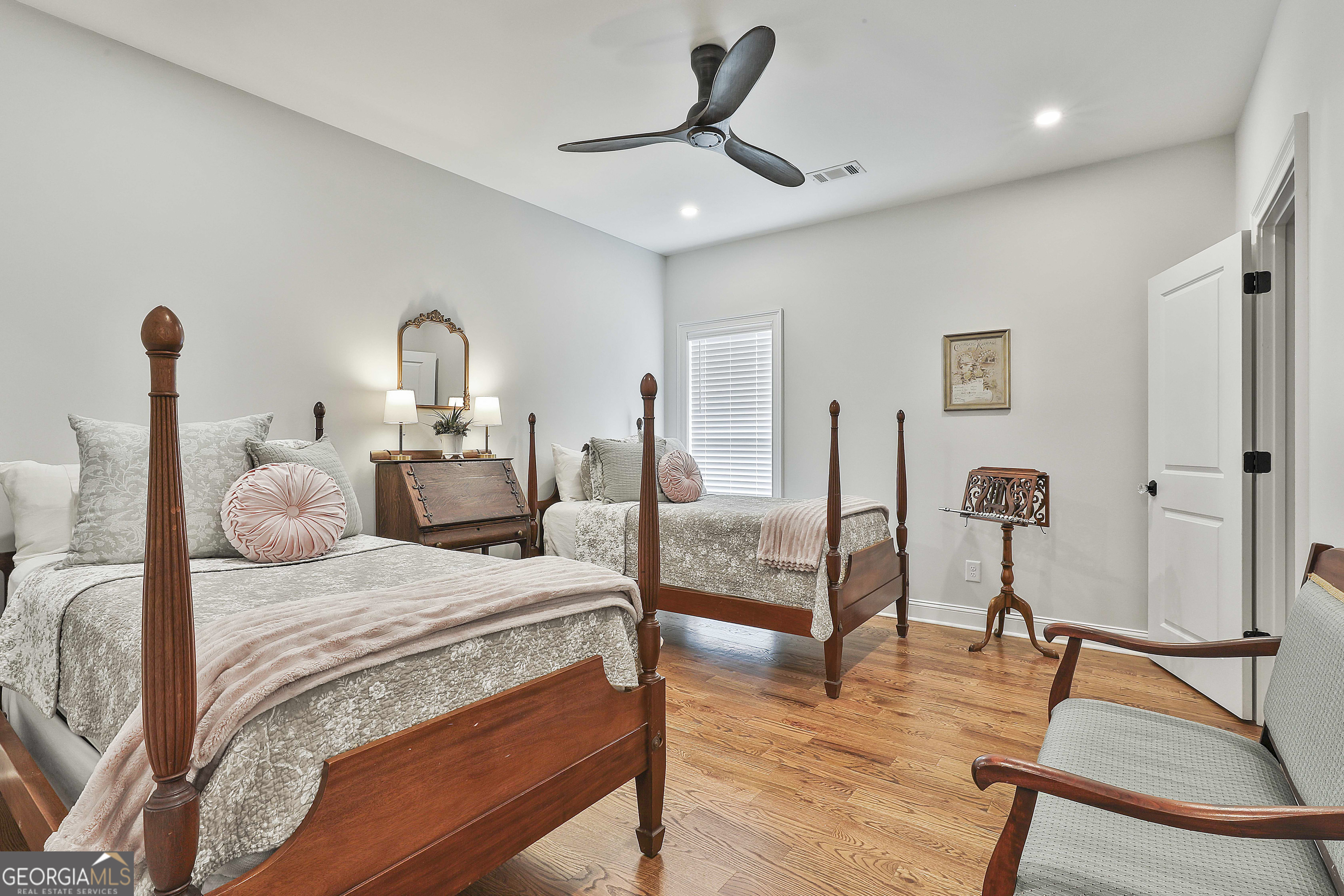 6 Casey Road Newnan, GA 30263 - Photo 34 of 46 a bedroom with a bed and a chandelier