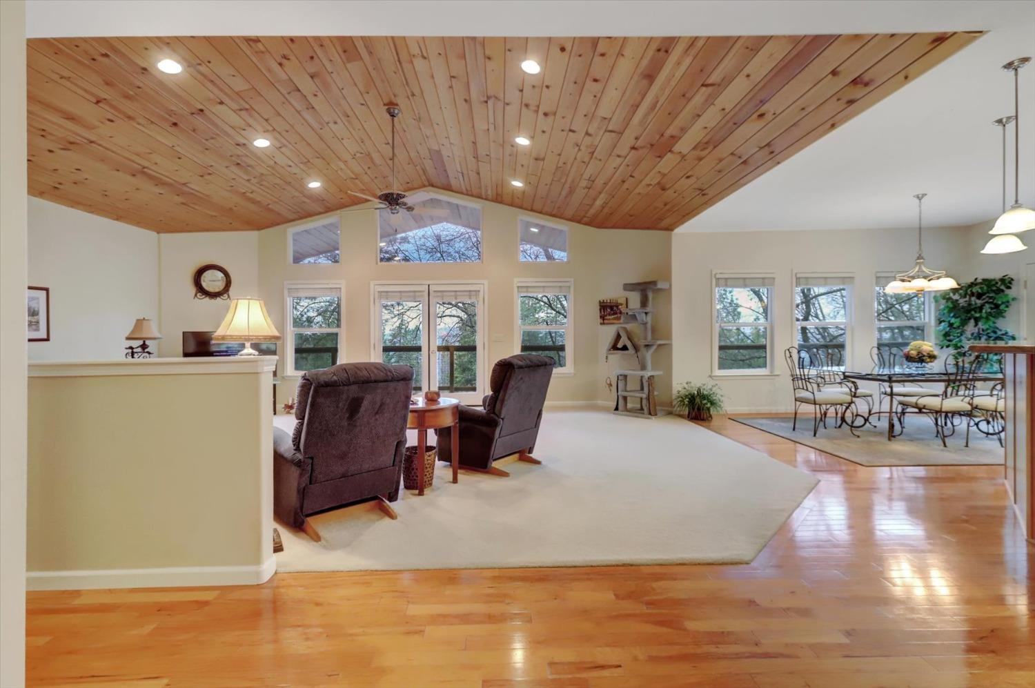 17036 Alice Way Grass Valley, CA 95949 - Photo 8 of 58 a living room with furniture a dining table and chairs with wooden floor