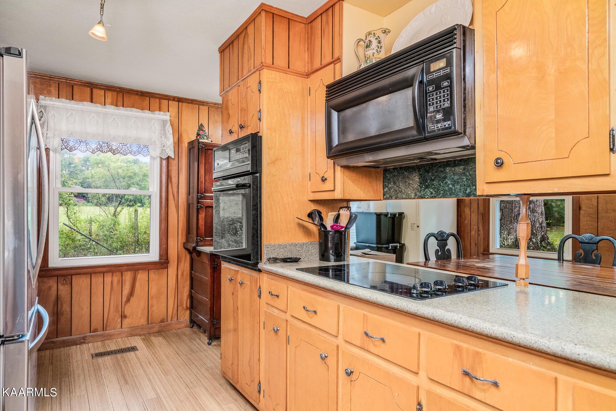 1360 Deep Draw Road Crossville, TN 38555 - Photo 12 of 40 a kitchen with stainless steel appliances granite countertop a stove a sink and a microwave