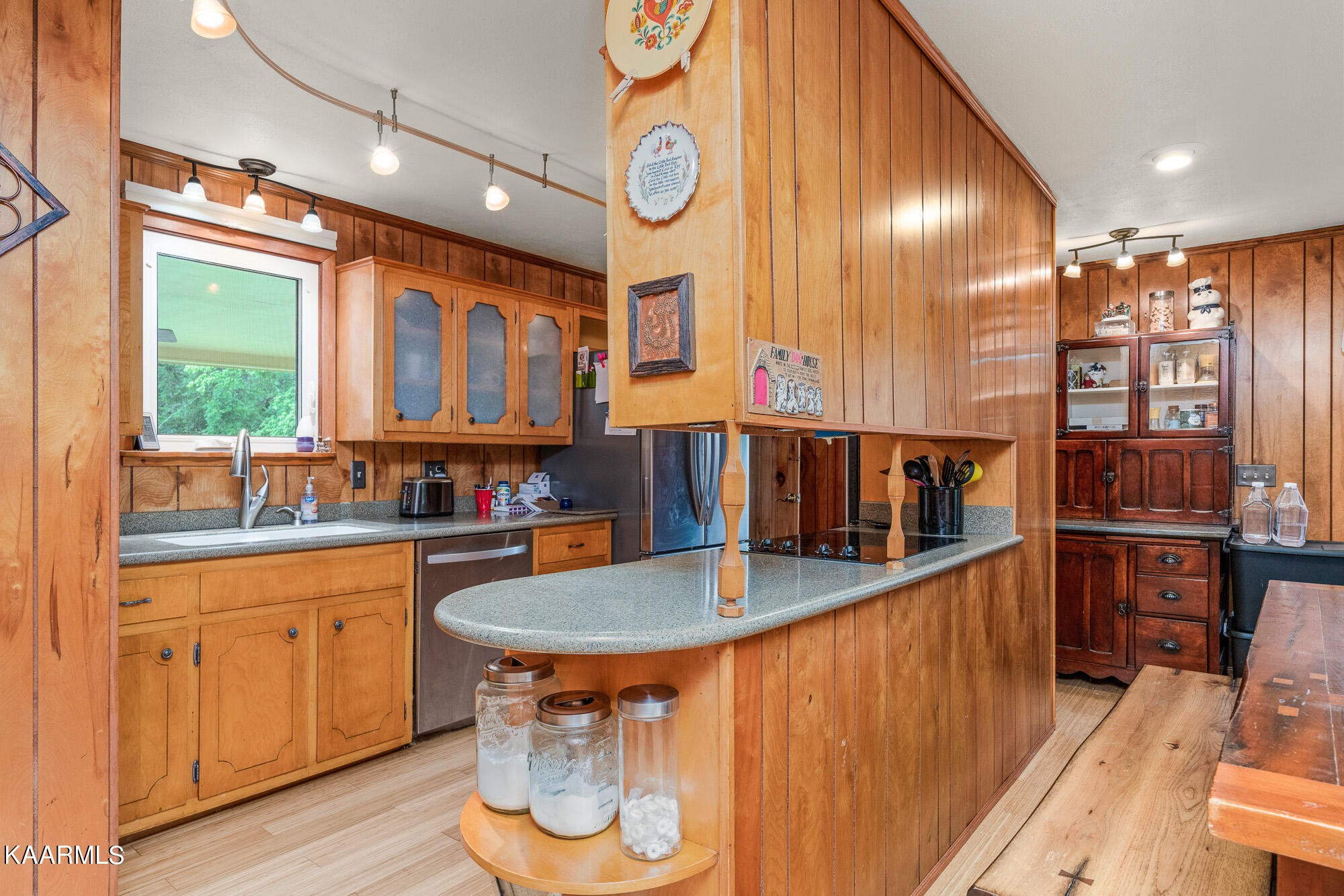 1360 Deep Draw Road Crossville, TN 38555 - Photo 13 of 40 a kitchen with stainless steel appliances granite countertop a sink and cabinets