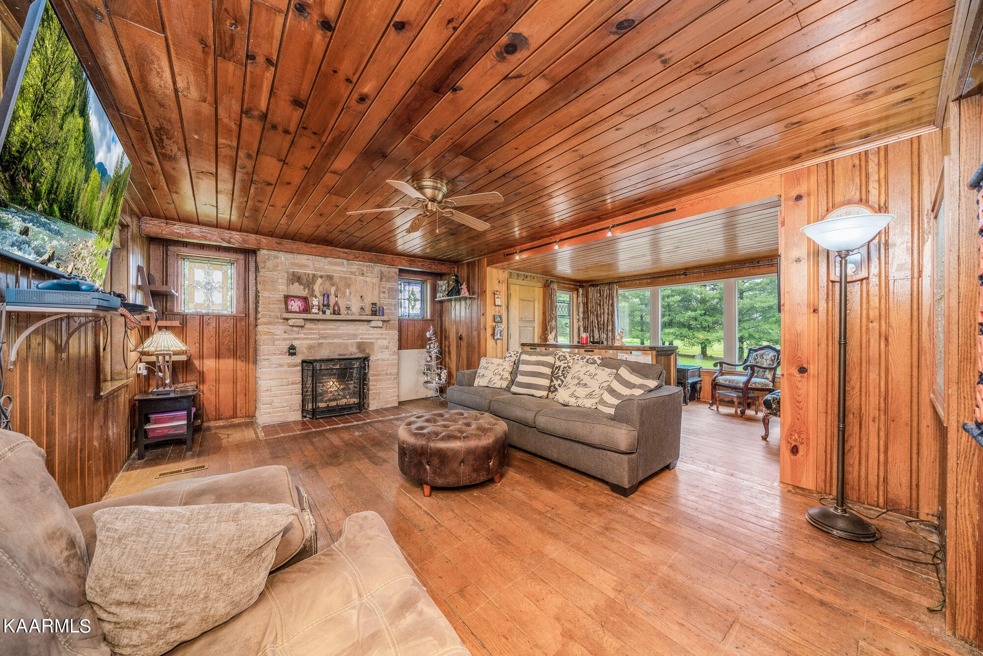1360 Deep Draw Road Crossville, TN 38555 - Photo 7 of 40 a living room with furniture a fireplace and a large window