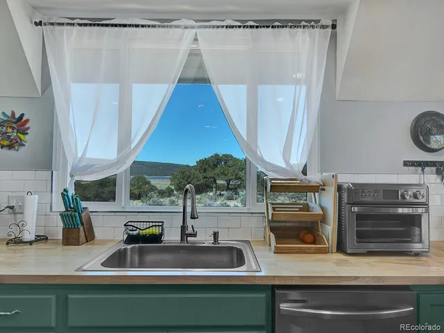 a kitchen with a sink and a refrigerator