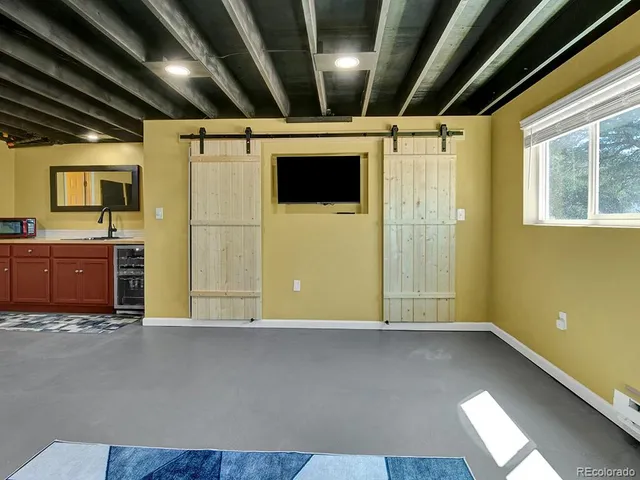 a kitchen with a sink and cabinets