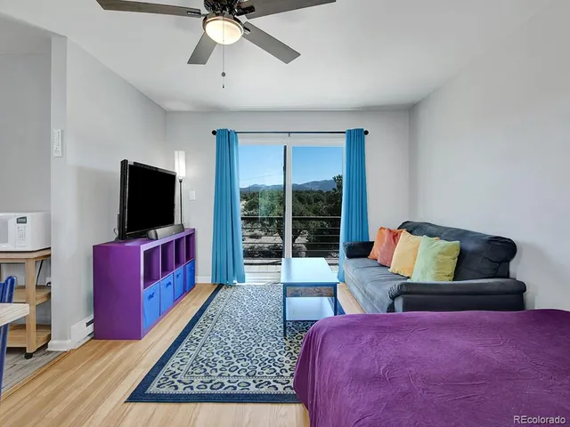 a bedroom with a bed and chair