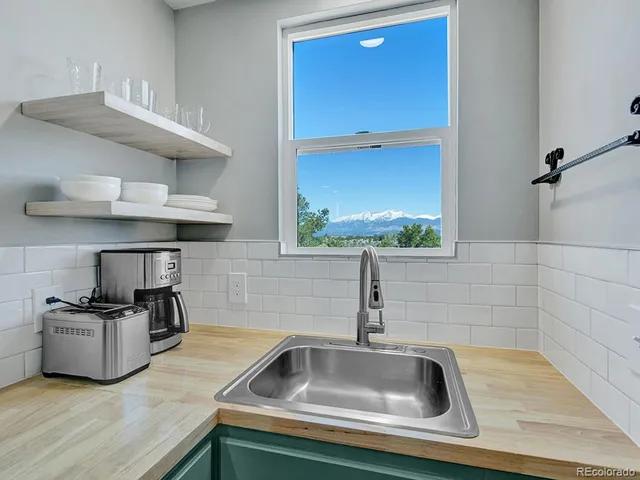 a bathroom with a sink a mirror and a toilet