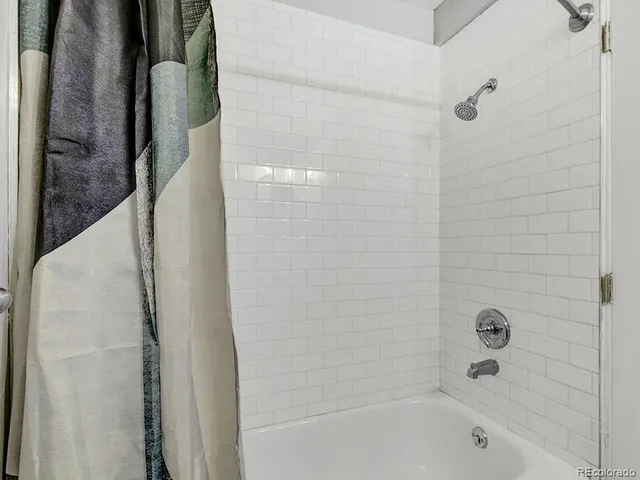 a view of a town with mountains in the background