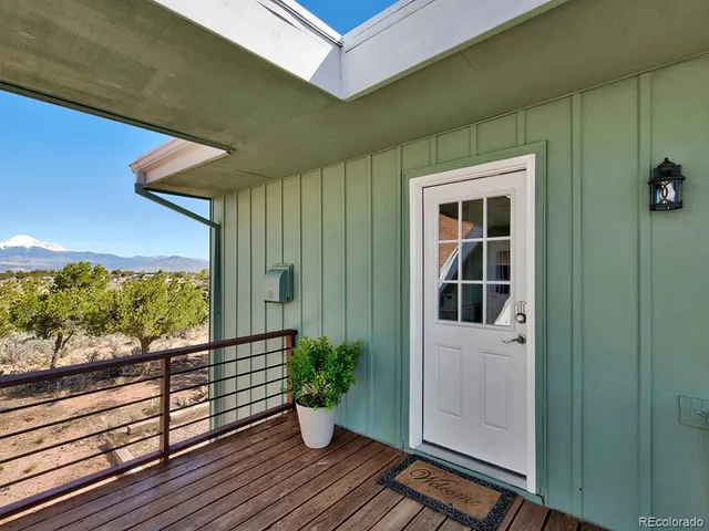a view of a balcony with potted plants