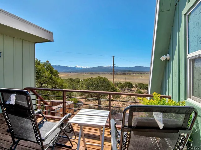 a view of a balcony with chairs
