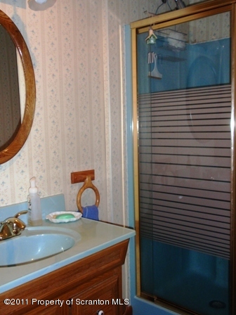 76 Indian Spring Road Tunkhannock, PA 18657 - Photo 11 of 18 a bathroom with a sink and a mirror