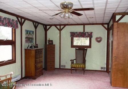 76 Indian Spring Road Tunkhannock, PA 18657 - Photo 13 of 18 a view of entryway with a large mirror and a chandelier fan