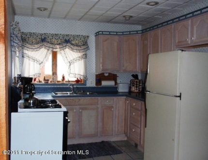 76 Indian Spring Road Tunkhannock, PA 18657 - Photo 8 of 18 a white refrigerator freezer sitting inside of a kitchen