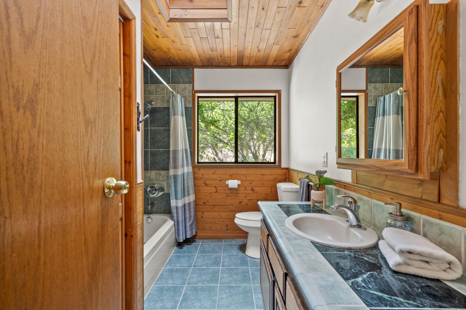 2162 Painted Pony Road Somerset, CA 95684 - Photo 18 of 65 a bathroom with a granite countertop sink and a mirror