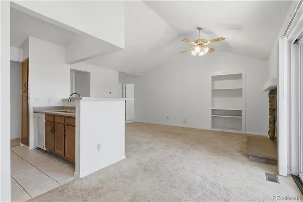 a utility room with cabinets washer and dryer