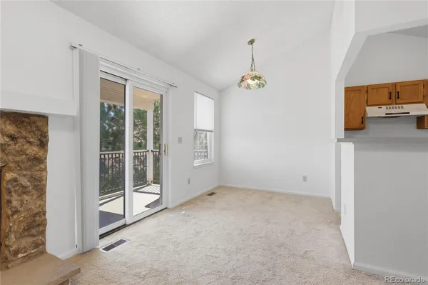 a view of an empty room with a windows