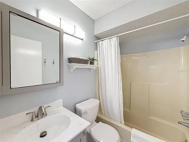 a bedroom with bed and a window