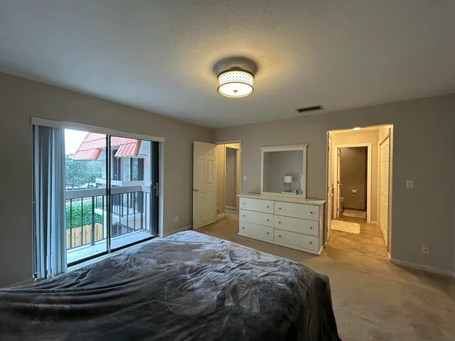 a view of a hallway with chandelier