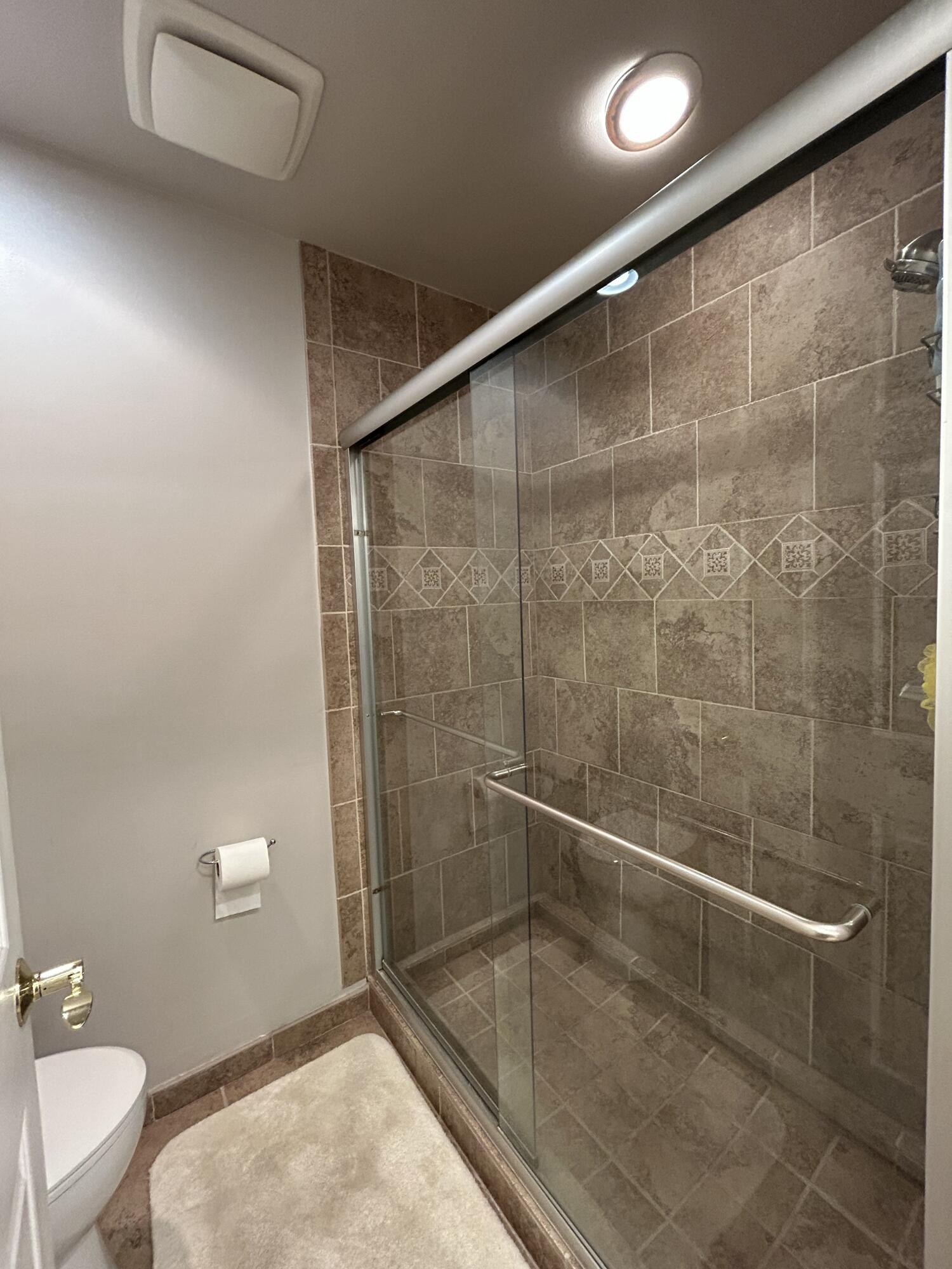 1251 South Federal Highway, Unit 1160 Boca Raton, FL 33432 - Photo 15 of 21 a bathroom with a shower and a toilet