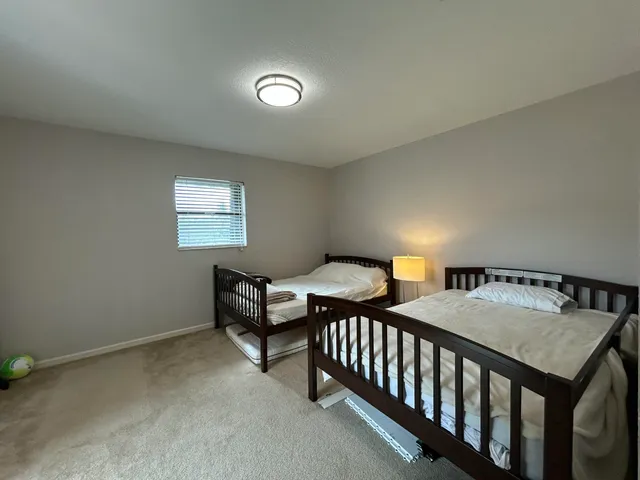 a bathroom with a shower and a toilet