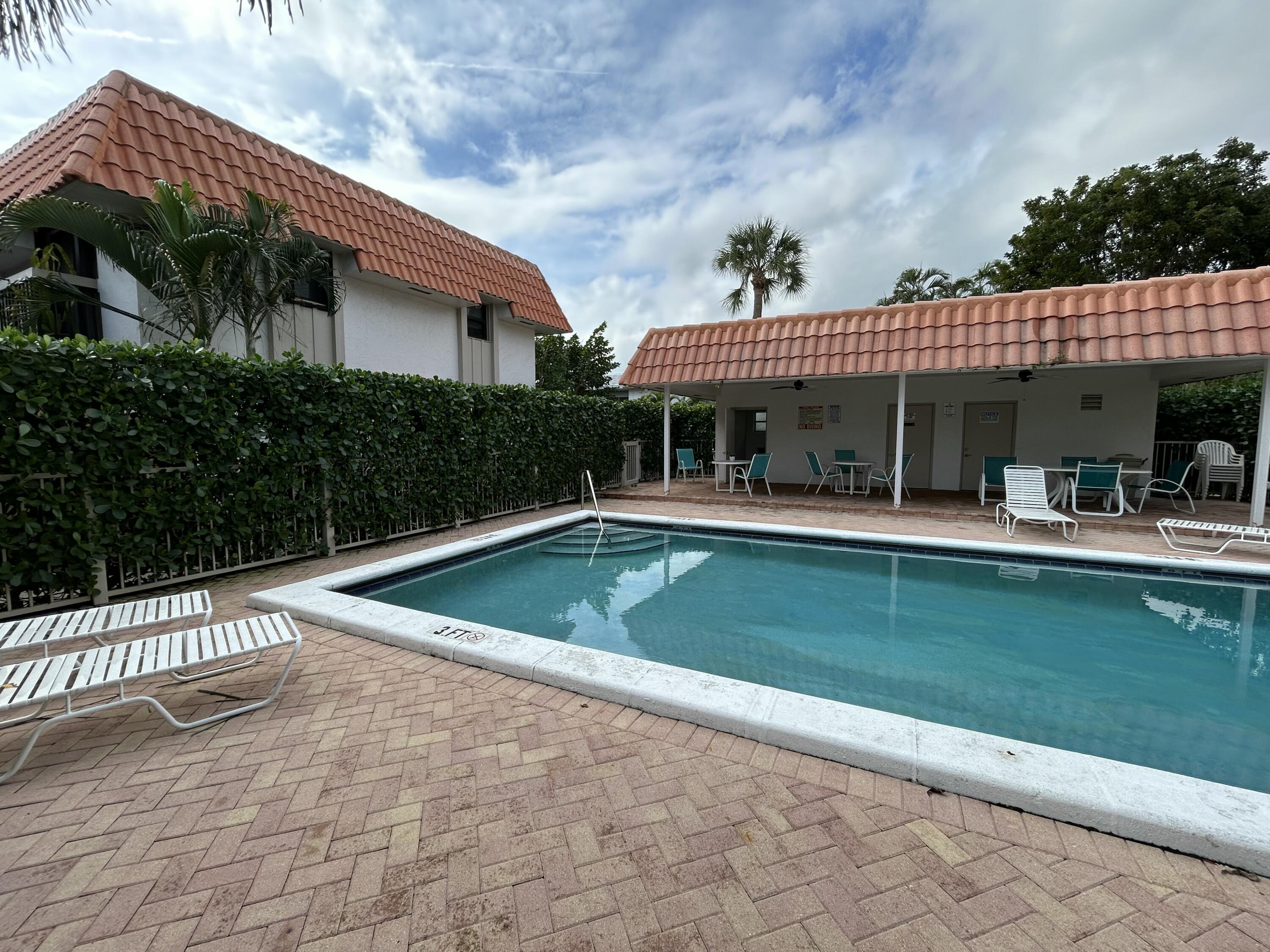 1251 South Federal Highway, Unit 1160 Boca Raton, FL 33432 - Photo 19 of 21 a view of house with swimming pool outdoor seating