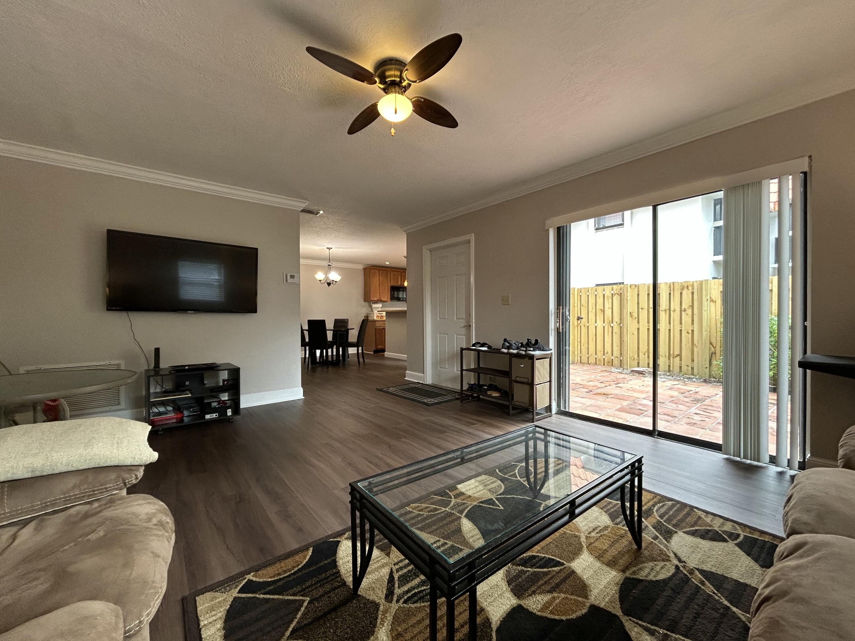 1251 South Federal Highway, Unit 1160 Boca Raton, FL 33432 - Photo 3 of 21 a living room with furniture and a flat screen tv