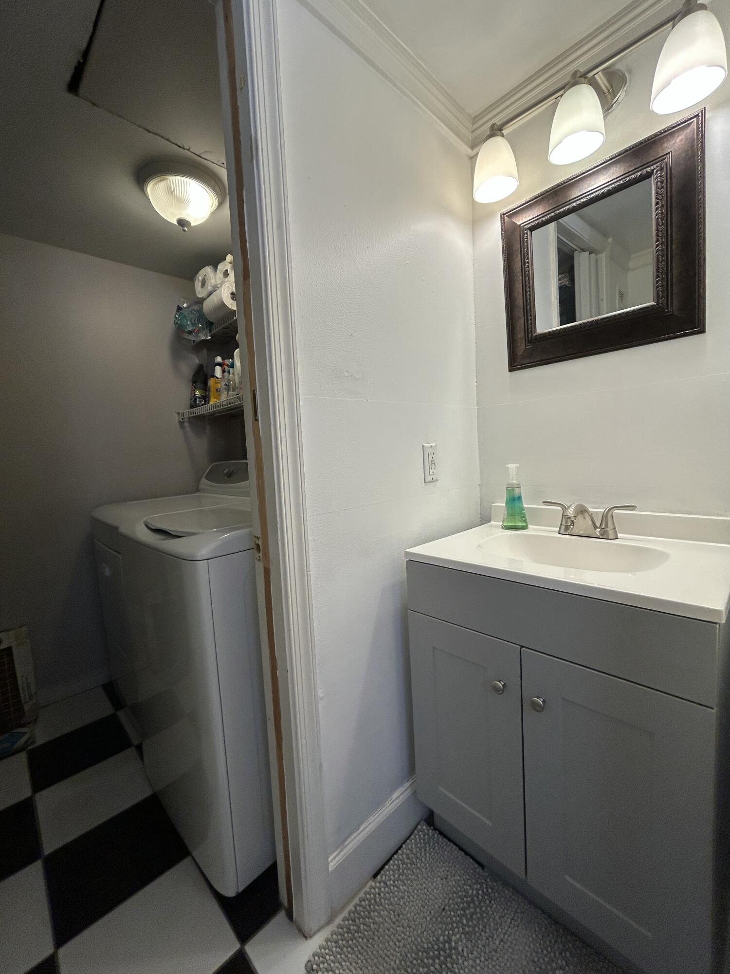 1251 South Federal Highway, Unit 1160 Boca Raton, FL 33432 - Photo 8 of 21 a bathroom with a sink and a mirror