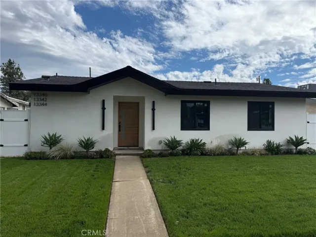 a front view of house with garden