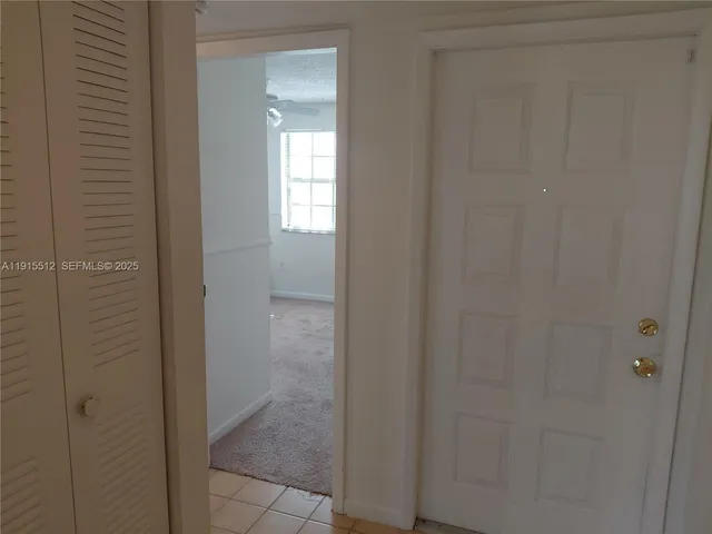 a view of a porch with a floor to ceiling window