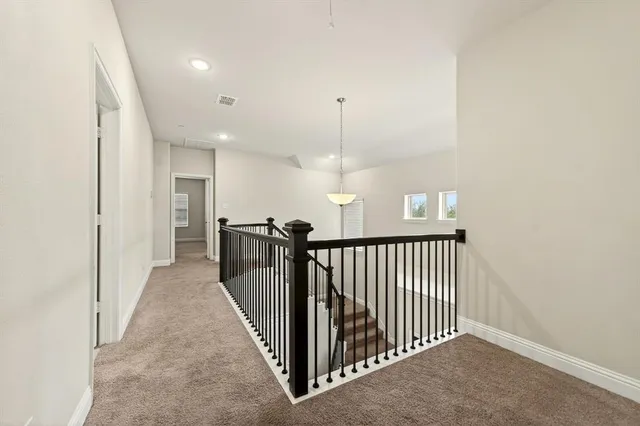 a view of a hallway with a livingroom