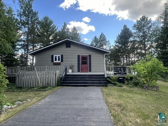 1804 North Bay Road Ely, MN 55731 - Photo 22 of 41 Single-story residence featuring horizontal siding, a red entry door, and black shutters