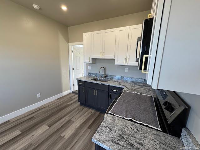 3135 Rte 9W, Unit 2 New Windsor, NY 12553 - Photo 19 of 27 a kitchen with stainless steel appliances granite countertop a stove a sink and a refrigerator